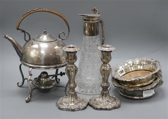 A quantity of plated ware including candlesticks, kettle, coasters and a claret jug